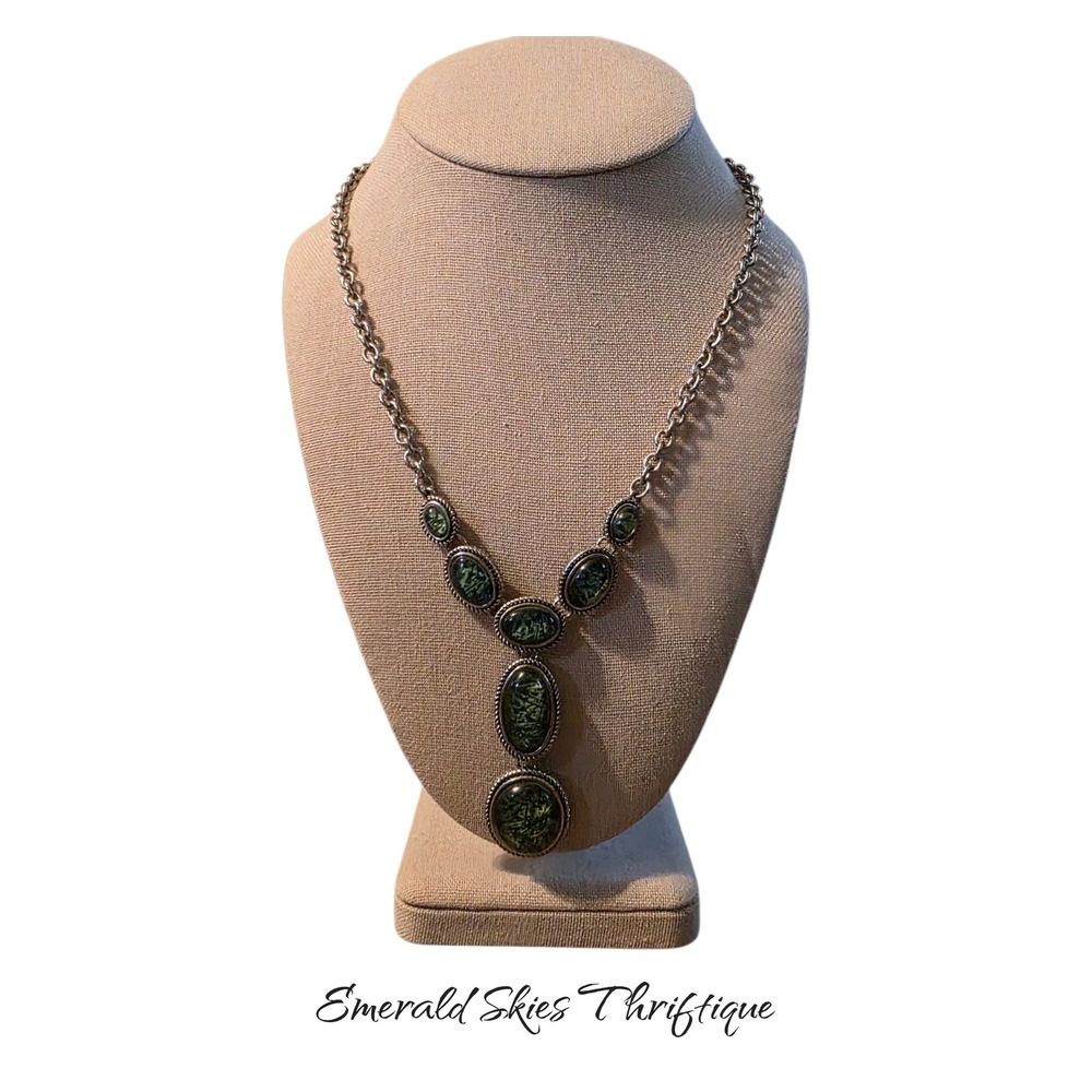 Napier silver-tone statement necklace featuring abstract green cabochon stones.